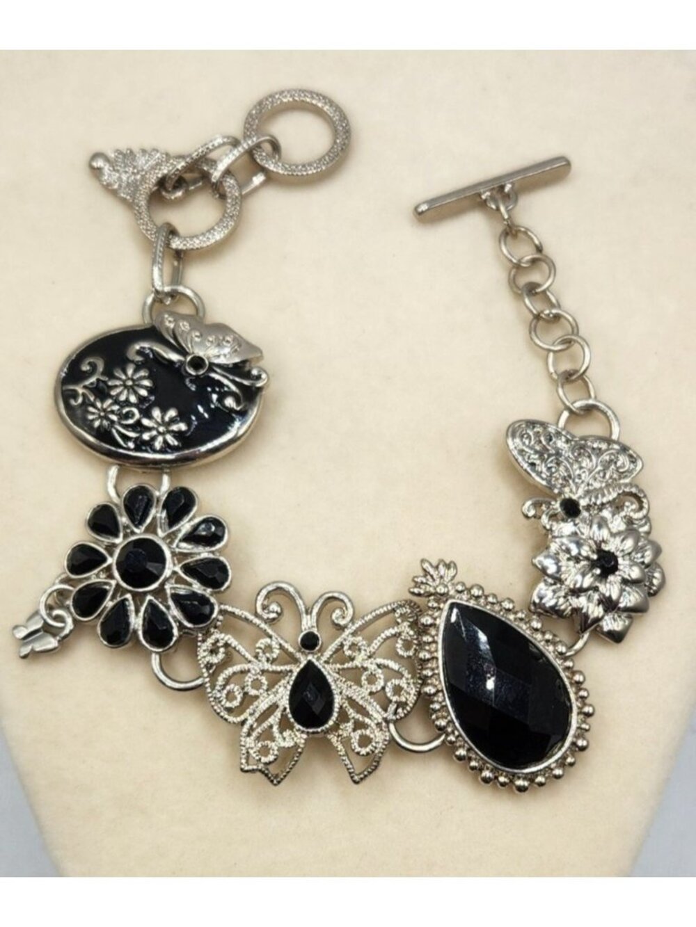 Silver Tone & Black Charm Bracelet With Butterfly & Floral Accents Toggle Clasp